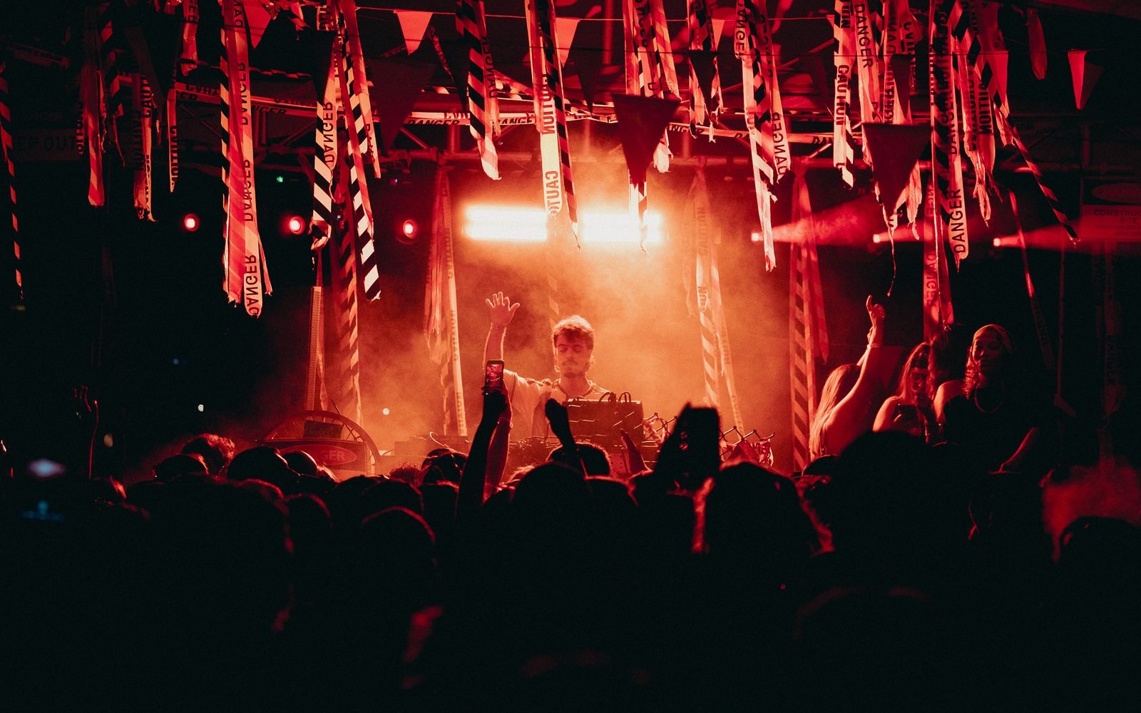 BLOOM DJ set under the festival rig, crowd with hands up